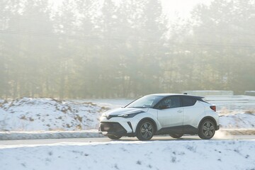 Driving Adventure on an Asphalt Road with the Warmth of Sunset Looming
