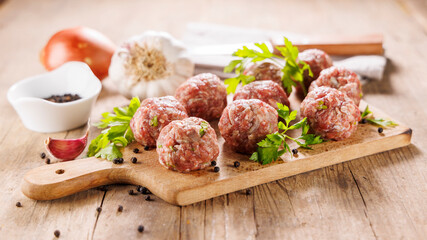 raw meatballs with herbs and spices