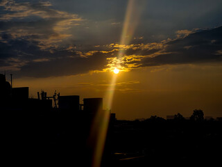 Orange light of setting sun illuminating the skyscrapers and high-rise buildings in Bangalore, India.