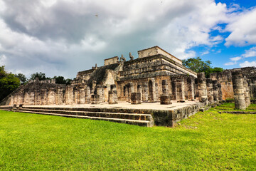 Naklejka premium Magnificent Temple of the Warriors,eastern complex,dedicated to the god Tlalchitonatiuh with a stone idol of the Mayan god of rain,Chaac Mool at Chichen Itza,built in 10th cent AD,Yucatan,Mexico 