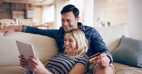 Home, credit card and couple on sofa, tablet and smile with ecommerce, mortgage and banking. Finance, man and woman on couch, tech and buying with transactions, online reading and payment in lounge