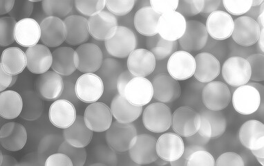 Soft Blurred Silver Bokeh Effect Creating a Dreamy Background for Holiday Decorations, Parties, or Elegant Design Projects with a Touch of Sophistication