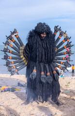 Kulasai Dasara, Portrait of indian male with painted face and dressed as hindu goddess kali to...