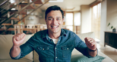 Man, happy and watching tv on sofa with celebration for sports, victory and excited in living room. Person, cheers and fist pump for live broadcast with winning, smile and relax on couch at apartment