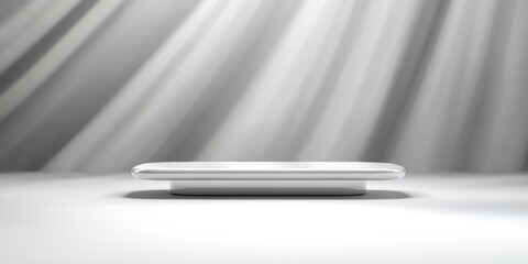 Minimalist Display Platform on Smooth Surface with Soft Gray Background and Gentle Light Rays Illuminating the Scene for Product Photography