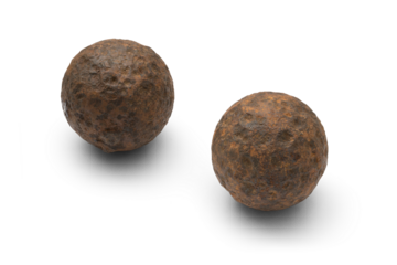 Two Authentic Rusty Civil War Cannonball Grape Shot Artifacts with Textured Surface isolated with transparent shadow