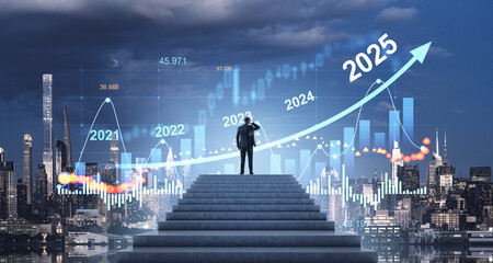 Businessman looking at financial growth charts forecasting 2025