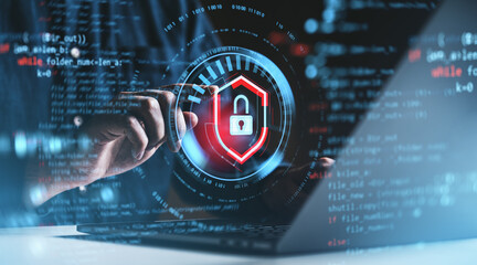 Hand interacting with digital security shield lock icon overlaid on programming code background.