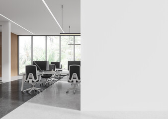 Modern office with empty blank wall space, desks, chairs, and large windows background. 3D Rendering
