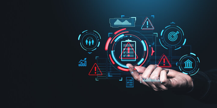 Hand interacting with futuristic digital icons representing risk management and safety on a dark background.