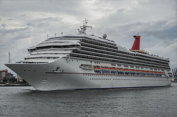Modern main line cruiseship cruise ship liner Victory sail away departure from Miami port, Florida...