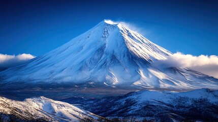 Stunning winter view of snowy mountains under clear blue sky during the day