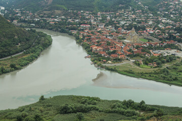 Fototapeta premium View From Jvari Monastery. The River Mtkvari Meets the River Aragvi from Khazbegi, background