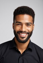Obraz premium smiling man, portrait, short curly hair, beard, wearing black shirt, white background, studio lighting, realistic photography, casual pose 