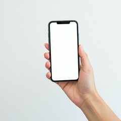 A person holds a smartphone with a blank white screen against a plain background.