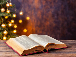 Obraz premium Open Book on Wooden Table with Christmas Lights Background