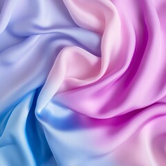 Obraz premium A soft, flowing fabric with a gradient of pastel colors blending from blue to pink, creating a serene and elegant visual texture.