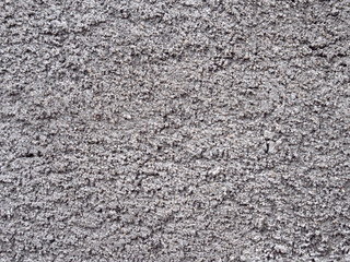 Structure of a single-colored concrete surface. Wall plaster in grey color