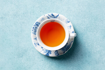 Cup of tea on a blue stone background. Close up. Top view.
