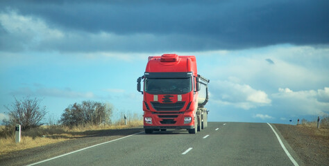 Truck driving at the highways. Transportation. Delivery