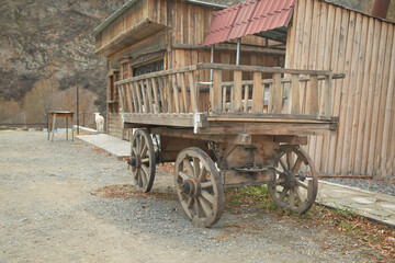 Old wooden cart with wheels.
