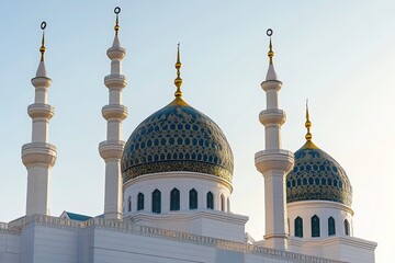 Close-up view of a mosque's architectural details domes and minarets against a clear sky.