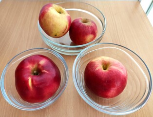 Red and green apples on the table