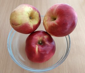 Red and green apples on the table