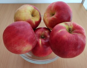 Red and green apples on the table