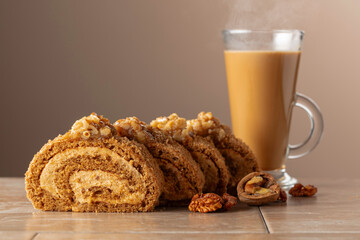 Dessert with walnuts and coffee latte on a beige background.