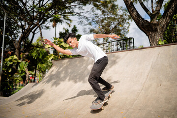 A skilled skater is performing a variety of impressive tricks in a vibrant outdoor skate park