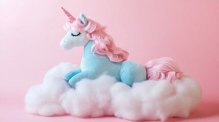 Charming unicorn plush toy with a pink mane and blue body resting on fluffy white clouds against a whimsical pink background, exuding a playful and dreamy atmosphere.