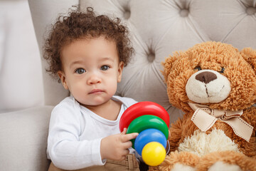 Cute baby with fluffy hair. Pretty boy.