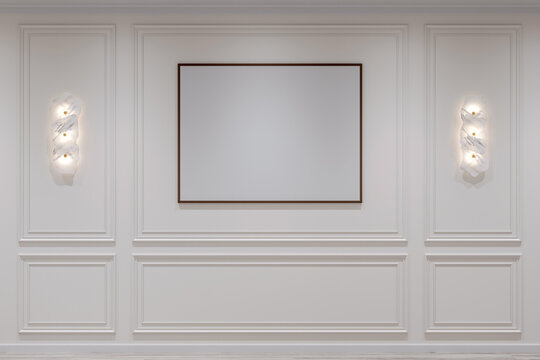 Naklejki White interior in modern classic style. Painting on the wall and wall lamps on the sides. Mockup of interior illustration. 3d rendering