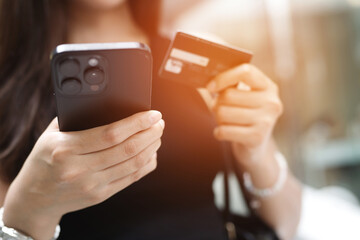 concept female to shopping Convenient instant. Customers can use the phone to shopping online Order purchase Sell and Payment with Credit Cards Do not have to travel having to shop store.