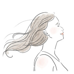 風に髪をたなびかせているロングヘアの若い女性