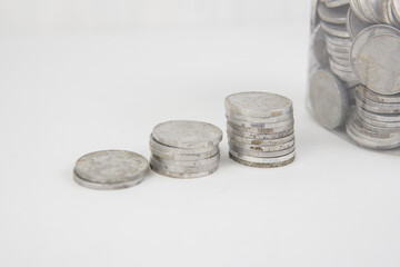 collection of Indonesian rupiah coins on a white background