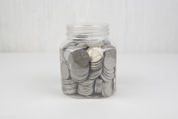 collection of Indonesian rupiah coins on a white background