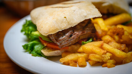Beef stake sandwich with french fries