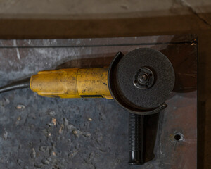 yellow metal cutter with a wheel