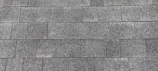 Fototapeta premium surface covered with grey rectangular tiles