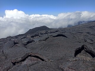 lava earth crust and scorched volcanic landscape on Piton de la Fournaise, La Réunion island....