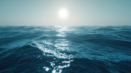 Fototapeta premium Deep blue sea with sunlight glimmering on the water surface, creating a peaceful and vast ocean background