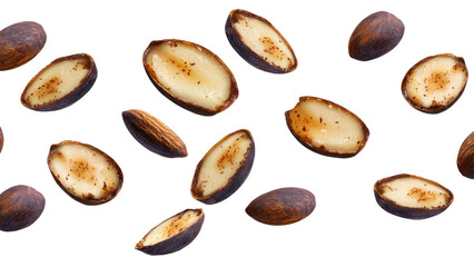 Obraz premium collection of Brazil nuts scattered on white background, showcasing their unique shapes and textures. nuts are both whole and halved, highlighting their rich, creamy interior