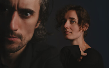 Love and Strength - A captivating close-up of a young couple, showcasing the balance of determination and delicacy against a striking black backdrop.