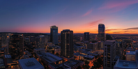 Obraz premium Nowoczesna panorama miasta z budynkami biurowymi i widokiem z drona o zachodzie słońca