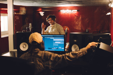 Sound engineer and percussionist during a studio recording session