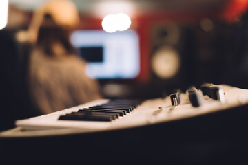 Close-up of a keyboard in a recording studio.