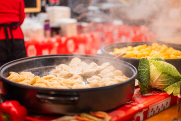 delicious national home-cooked grilled food at the festive Christmas market in Gdansk Poland