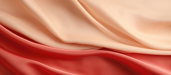 Fototapeta premium Beige silk texture draped over a vibrant red canvas creating an elegant background for artistic and design purposes.